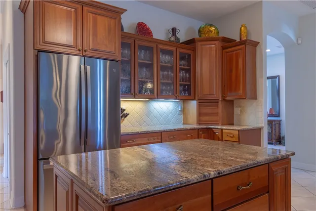 a kitchen with stainless steel appliances granite countertop a sink and cabinets
