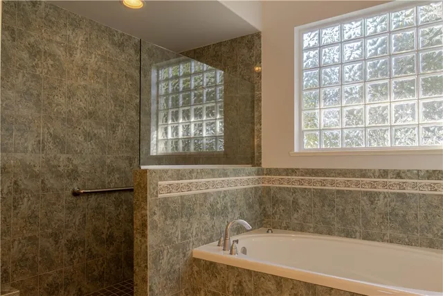 a view of a livingroom with furniture and windows