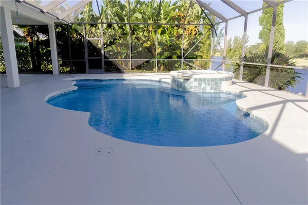 a view of a swimming pool with a patio