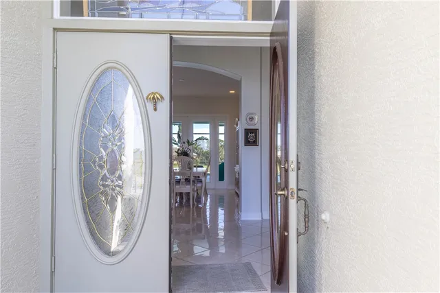 a view of a livingroom with furniture and a mirror