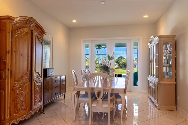 a view of a dining room with furniture and window