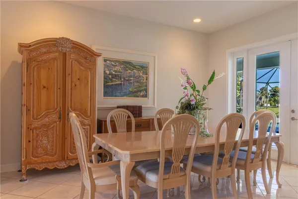 a view of a dining room with furniture and window