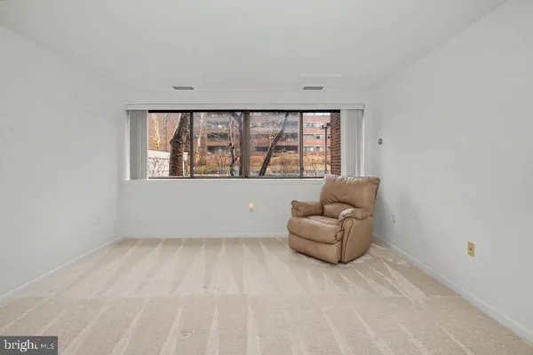 a living room with a couch and a window
