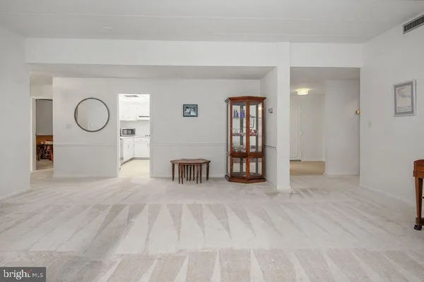 a view of a livingroom with furniture and window