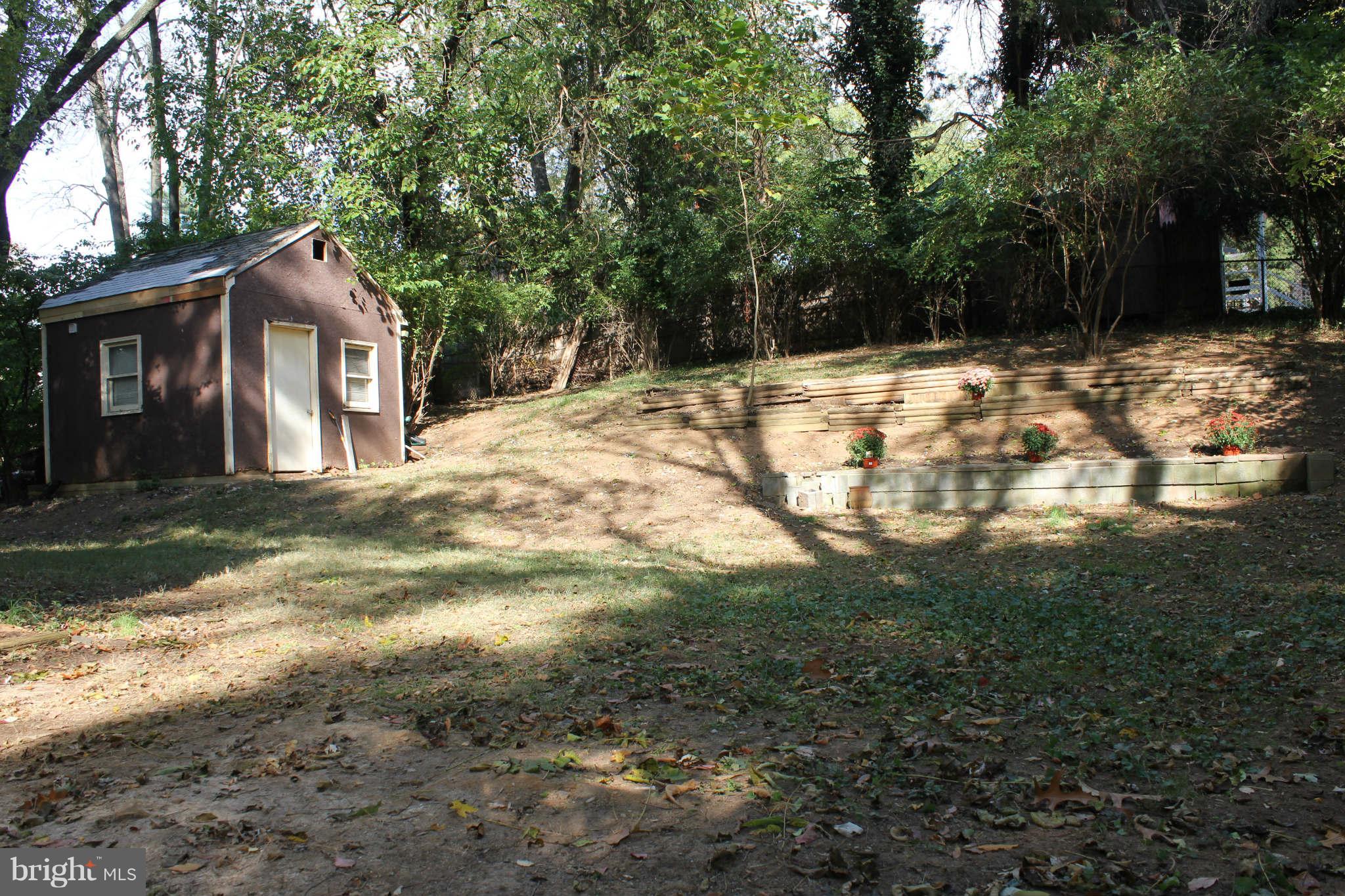 12107 Dewey Road Silver Spring, MD 20906 - Photo 4 of 30 a backyard of a house