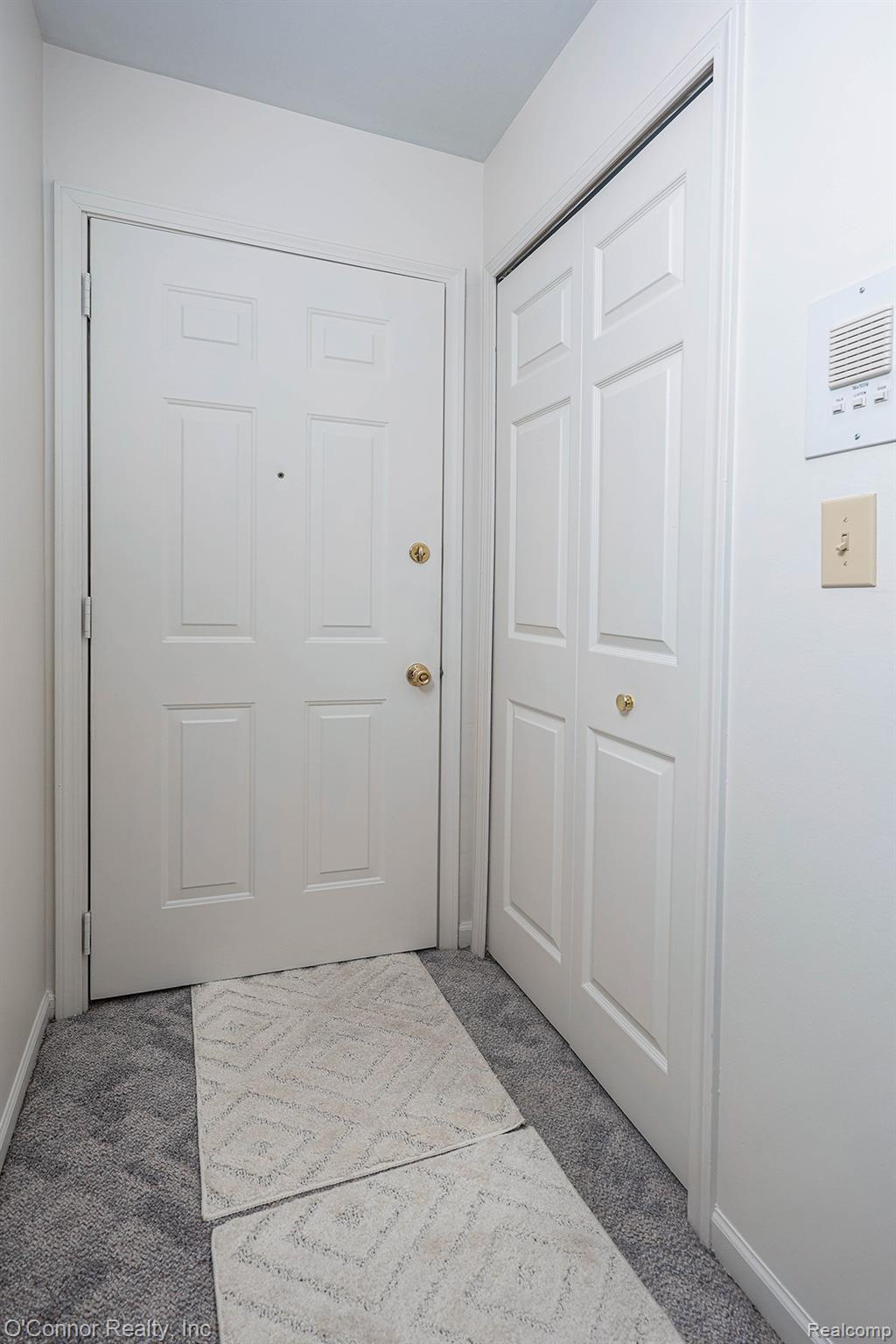 1660 River Road, Unit 53 Marysville, MI 48040 - Photo 10 of 31 Doorway to outside with carpet flooring