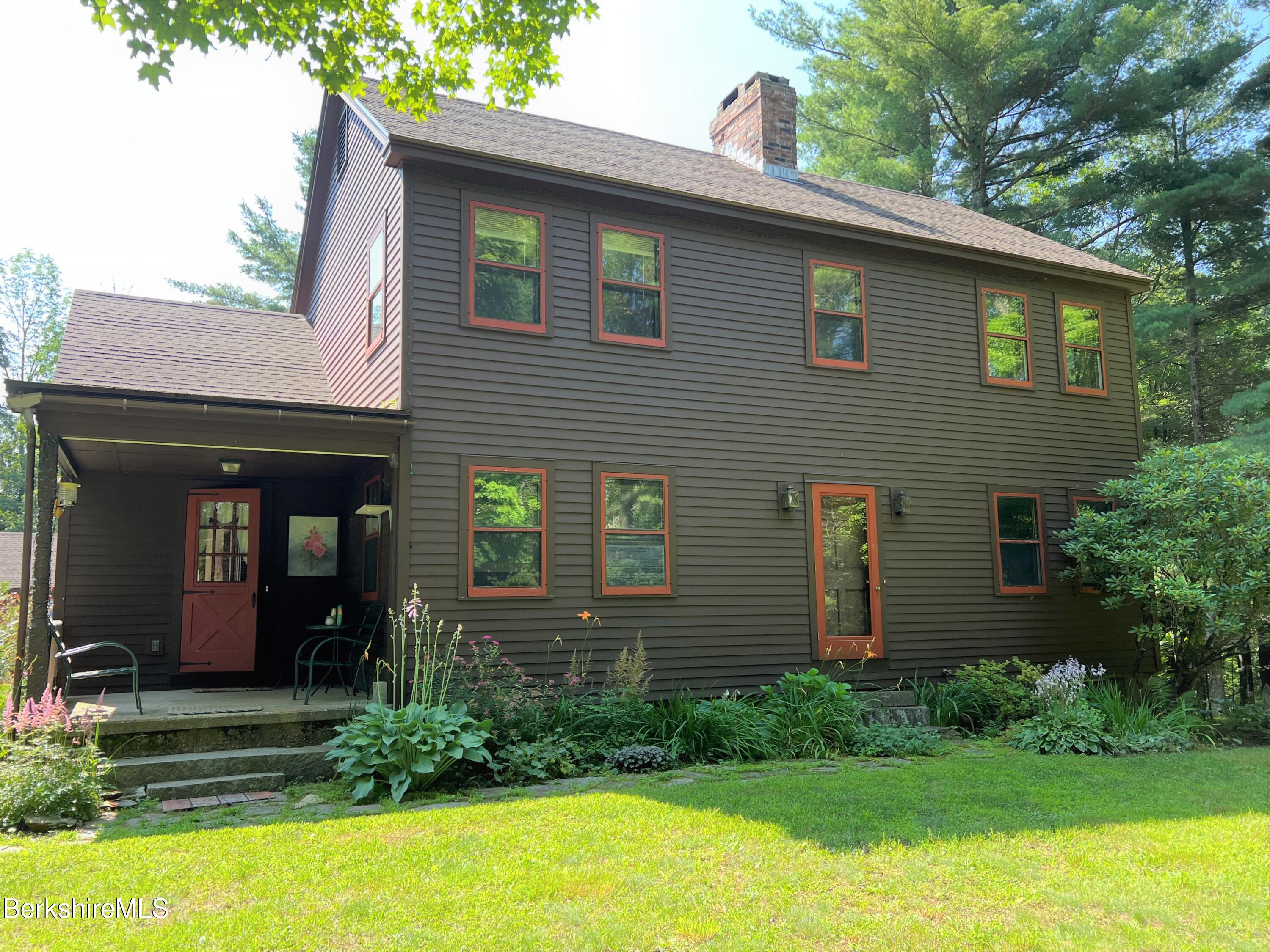 280 Middlefield Road Washington, MA 01223 - Photo 1 of 28 a front view of a house with garden