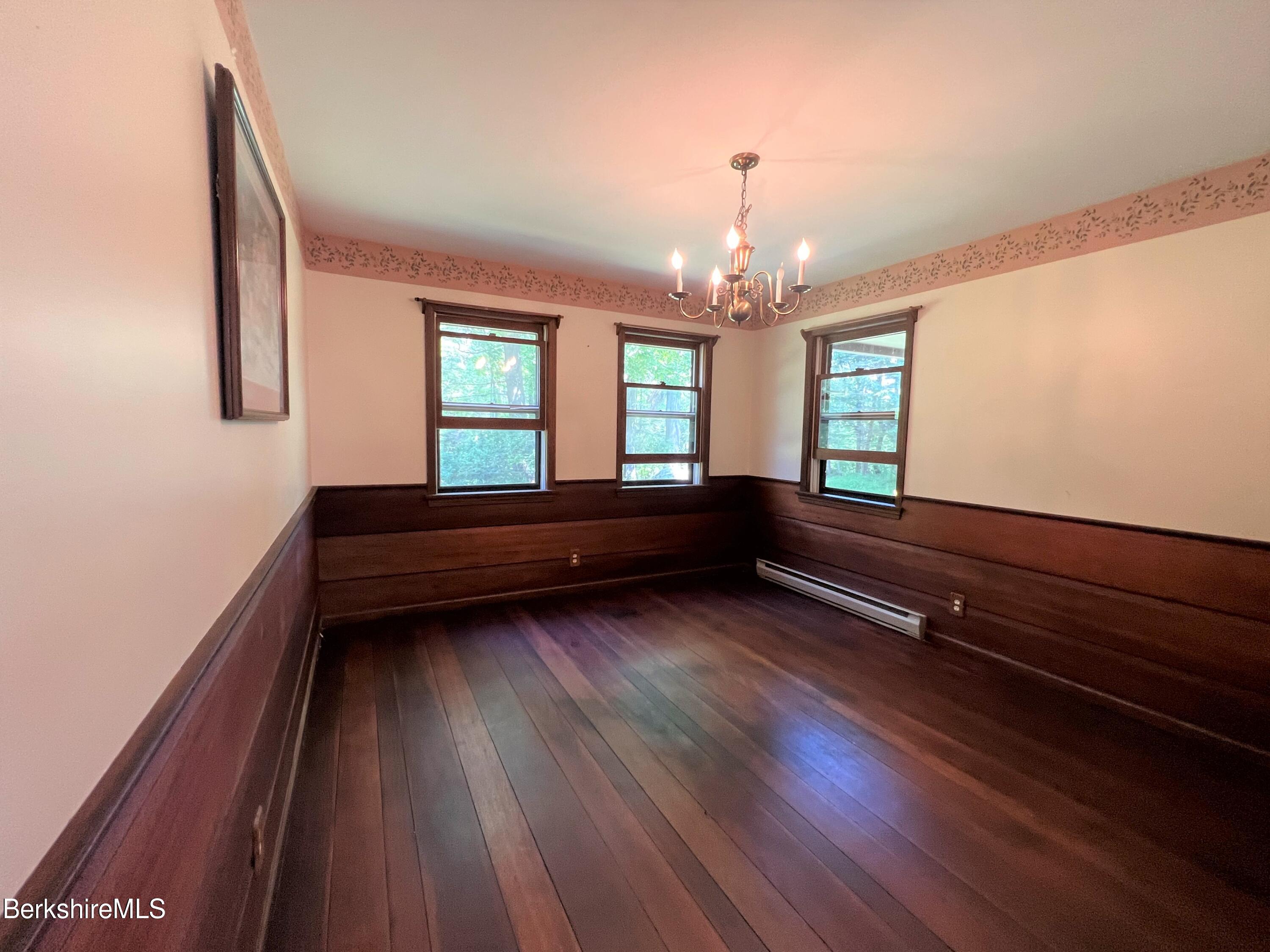 280 Middlefield Road Washington, MA 01223 - Photo 14 of 28 a room with wooden floors and windows