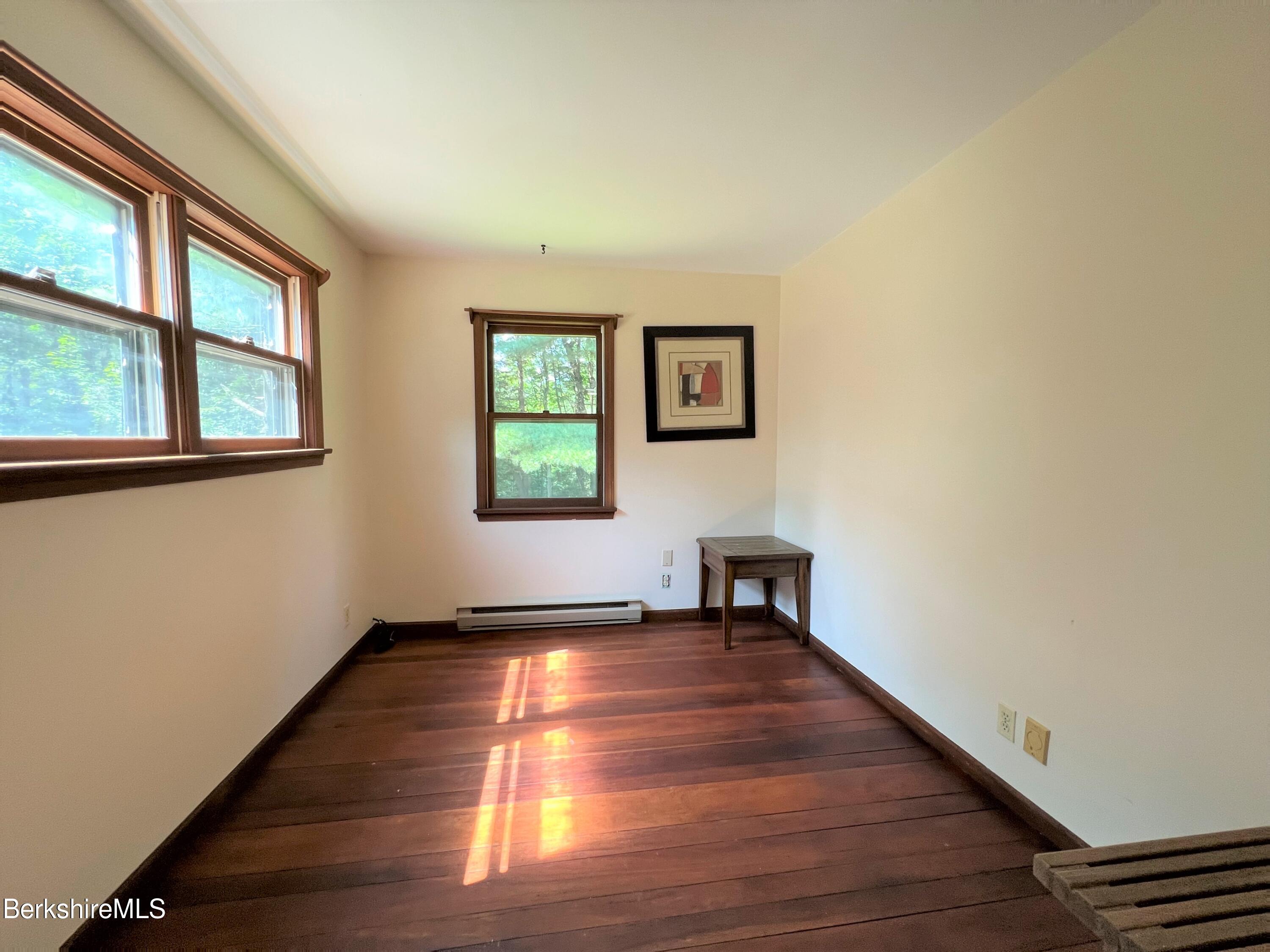 280 Middlefield Road Washington, MA 01223 - Photo 15 of 28 a view of an empty room with wooden floor and a window