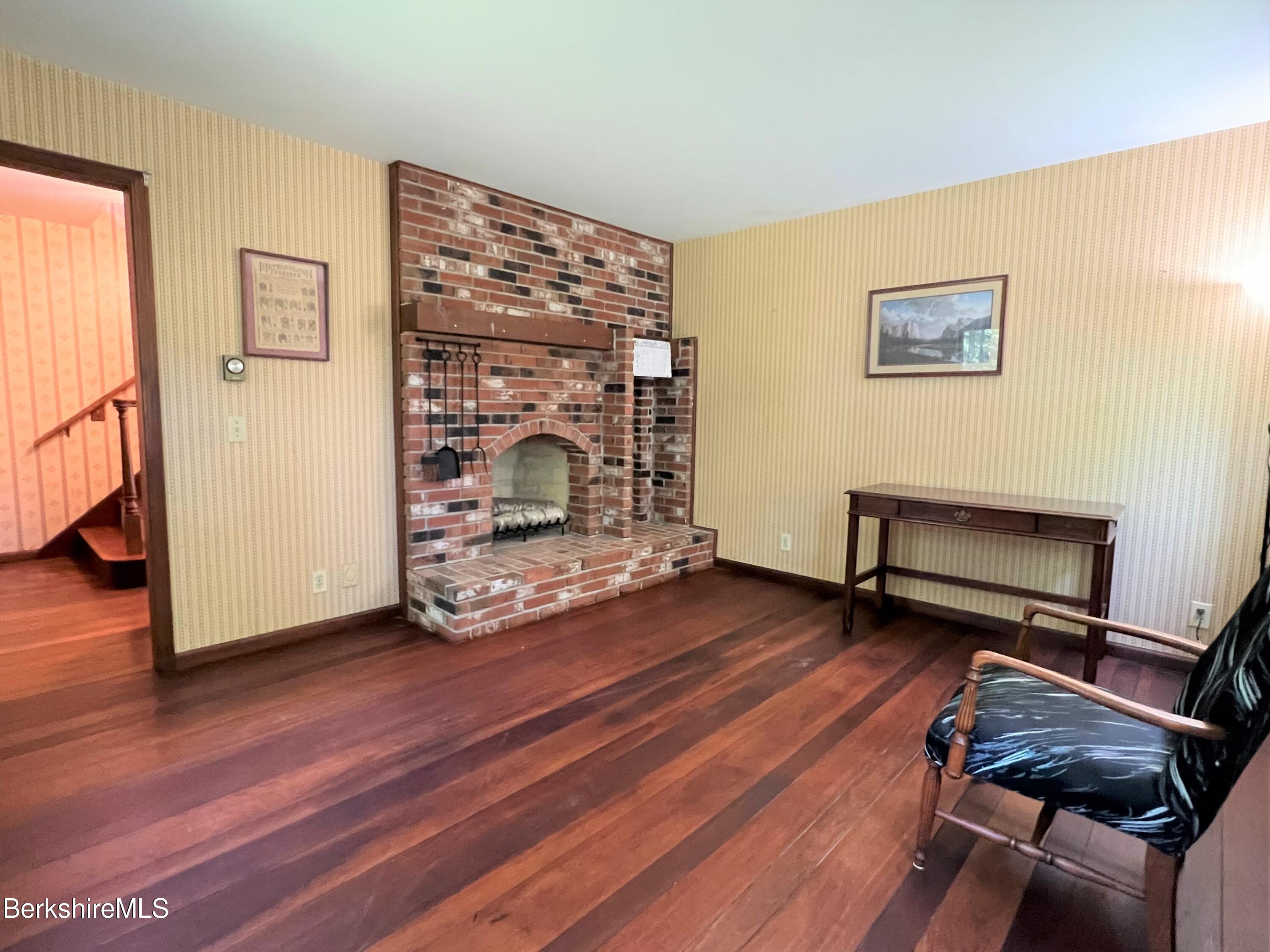 280 Middlefield Road Washington, MA 01223 - Photo 17 of 28 a view of a livingroom with furniture and a wooden floor