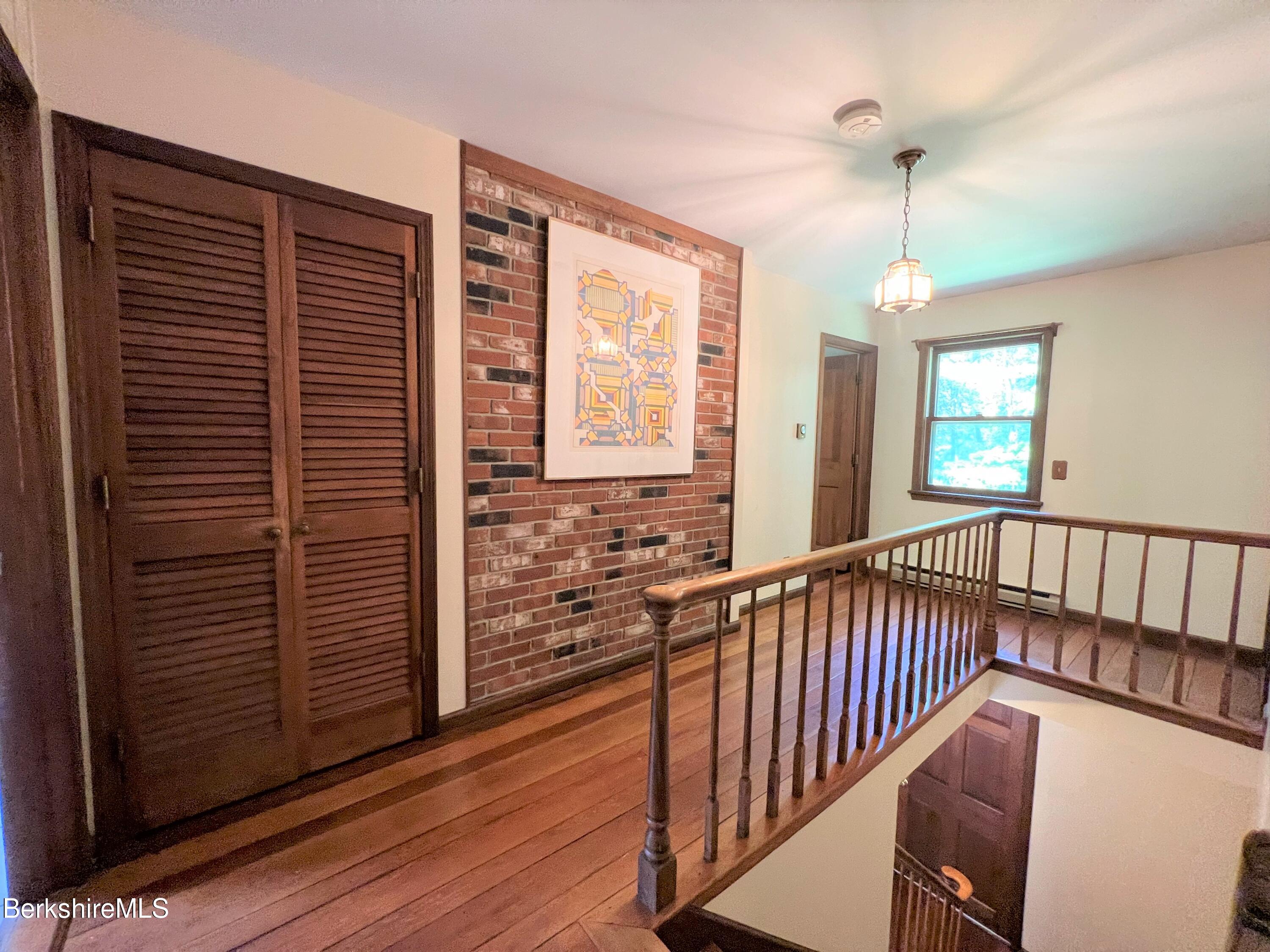 280 Middlefield Road Washington, MA 01223 - Photo 18 of 28 a view of a hallway with wooden floor and windows