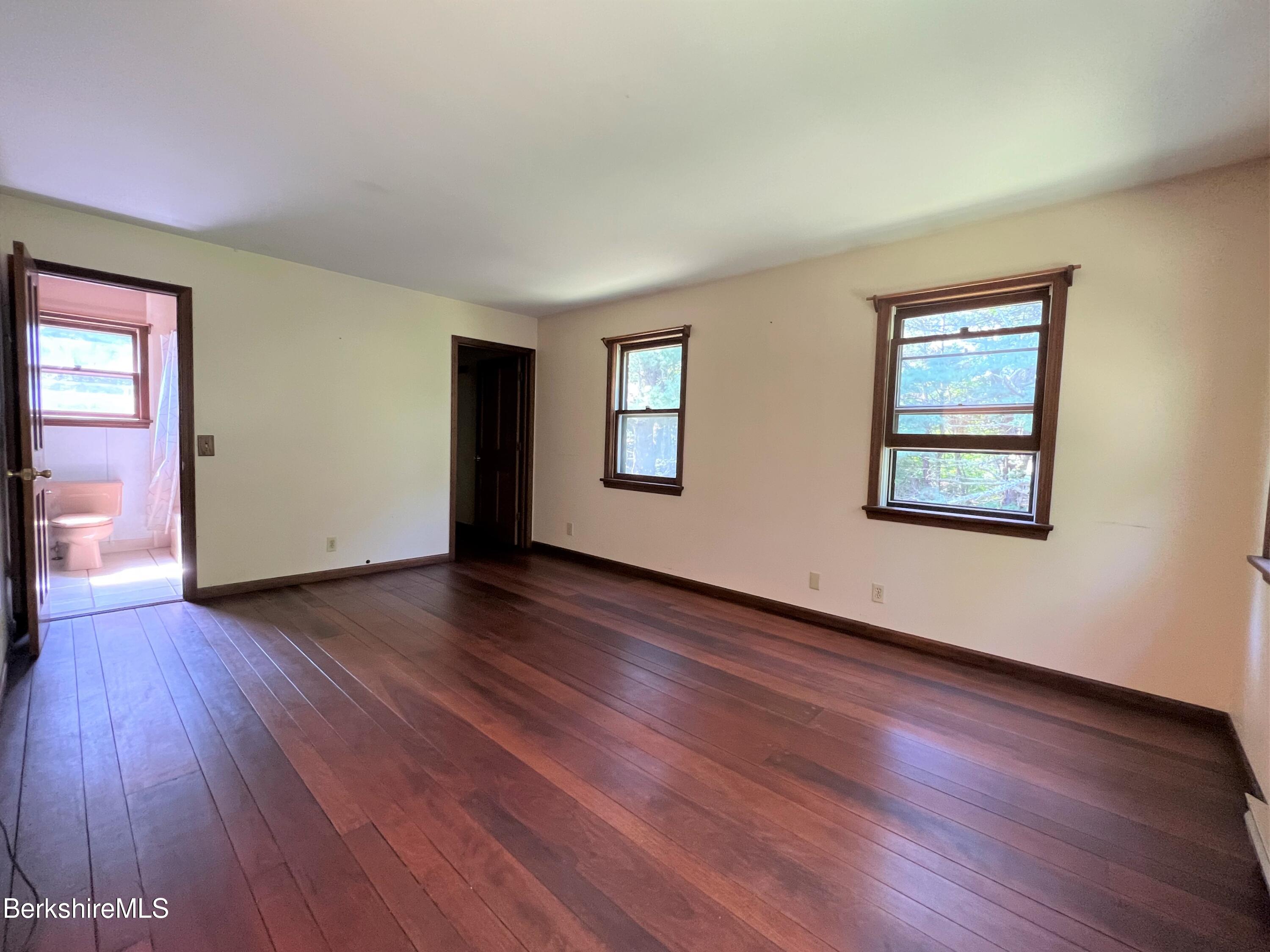 280 Middlefield Road Washington, MA 01223 - Photo 19 of 28 a view of an empty room with wooden floor and a window