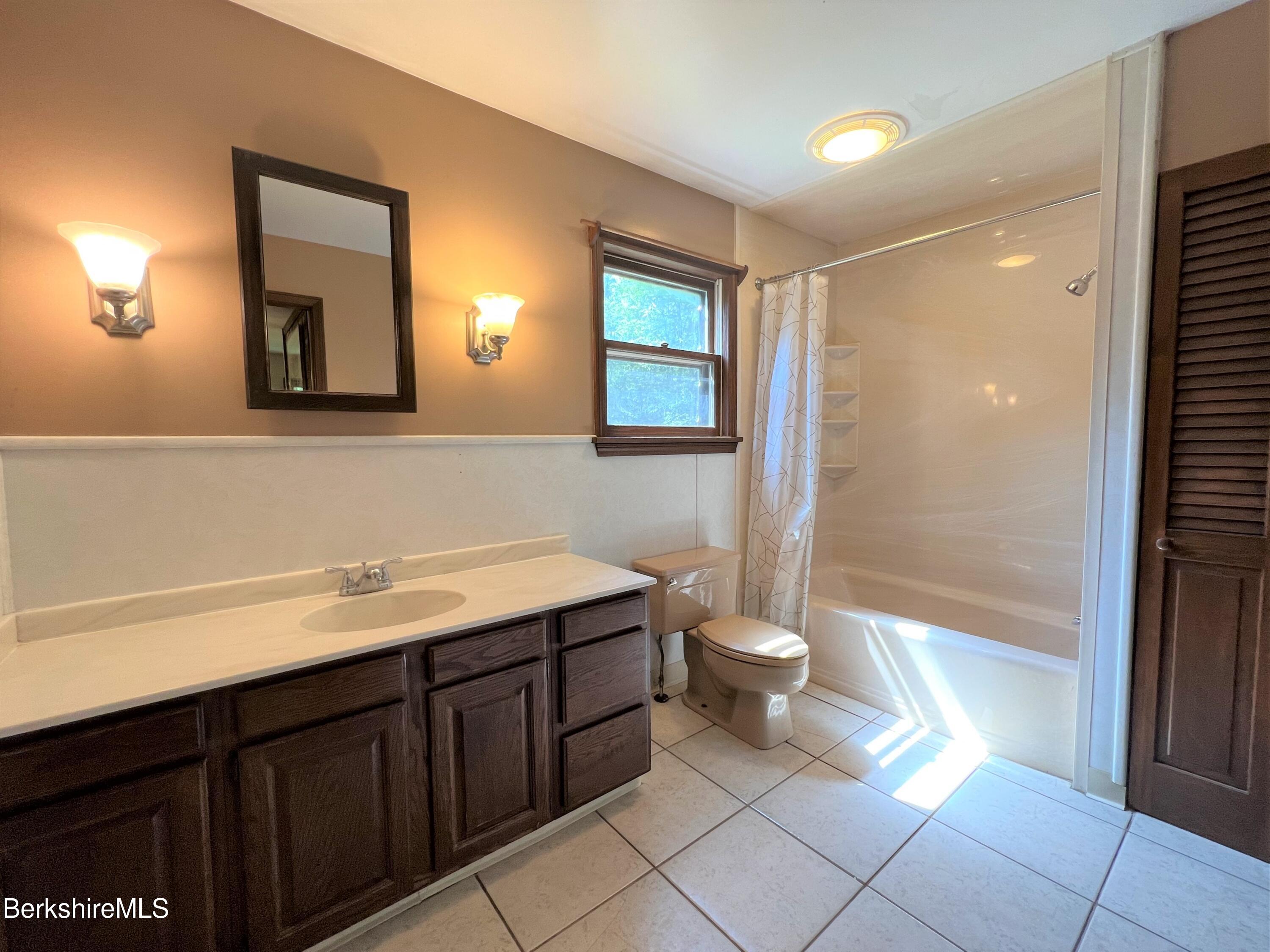 280 Middlefield Road Washington, MA 01223 - Photo 20 of 28 a bathroom with a double vanity sink toilet and shower