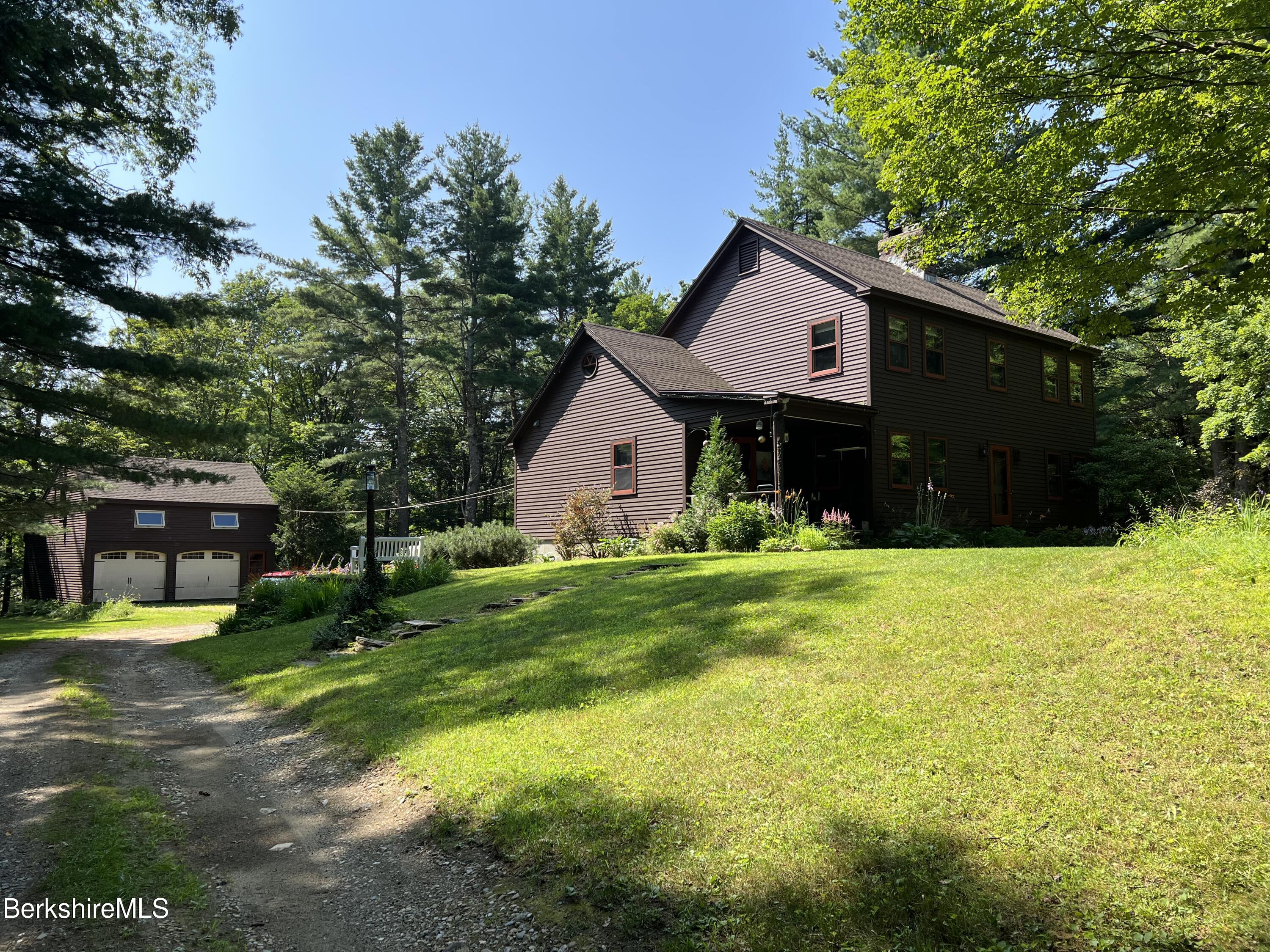 280 Middlefield Road Washington, MA 01223 - Photo 2 of 28 a front view of a house with garden