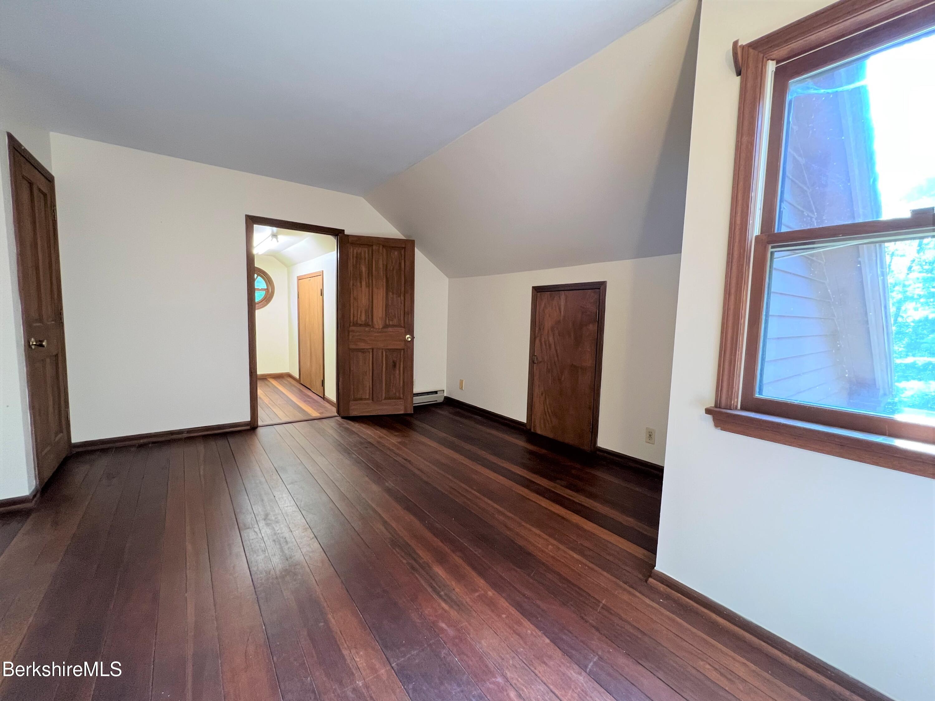 280 Middlefield Road Washington, MA 01223 - Photo 21 of 28 a view of an empty room with wooden floor and a window
