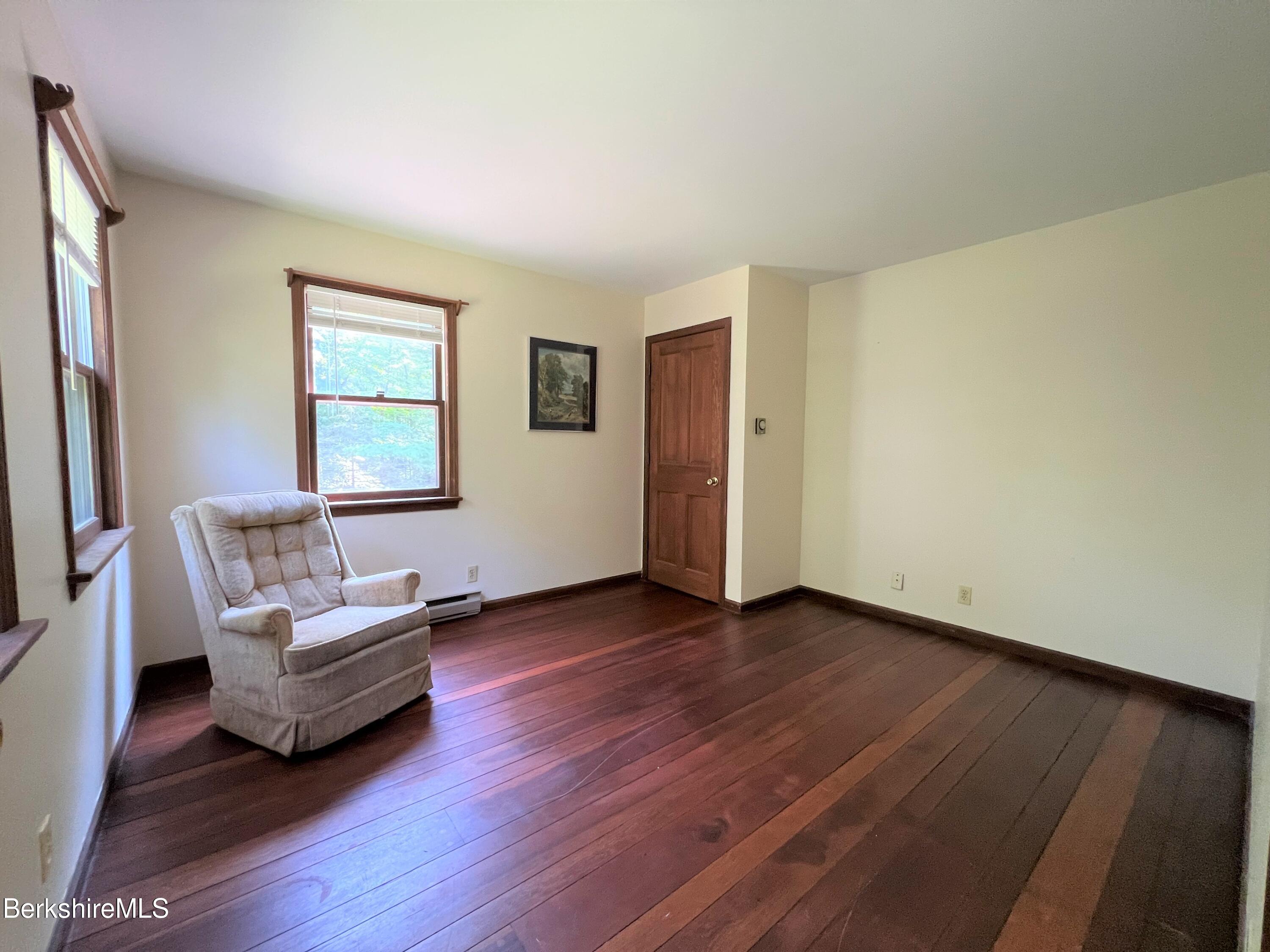 280 Middlefield Road Washington, MA 01223 - Photo 23 of 28 a living room with furniture and a wooden floor