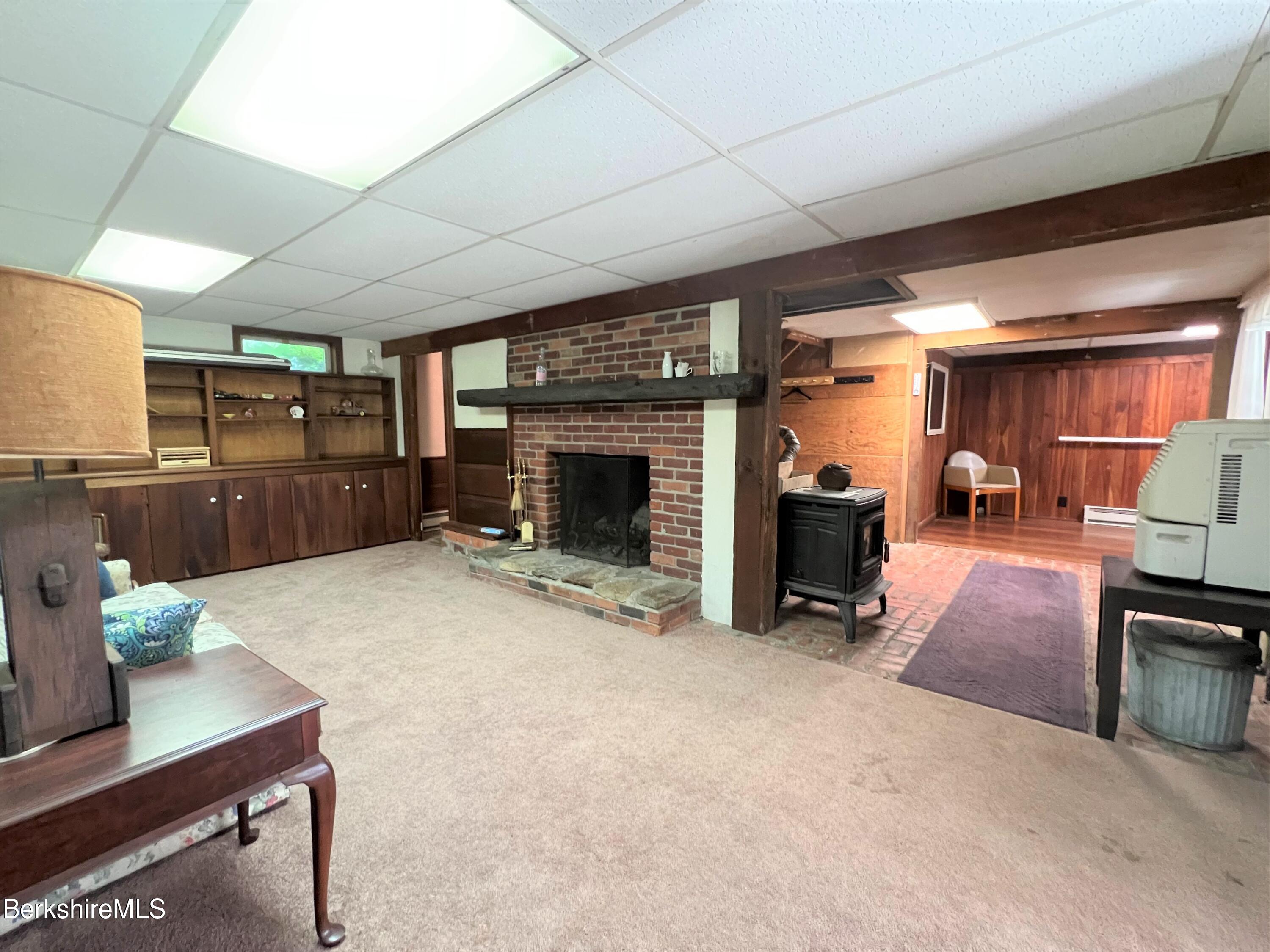 280 Middlefield Road Washington, MA 01223 - Photo 24 of 28 a living room with furniture and a fireplace