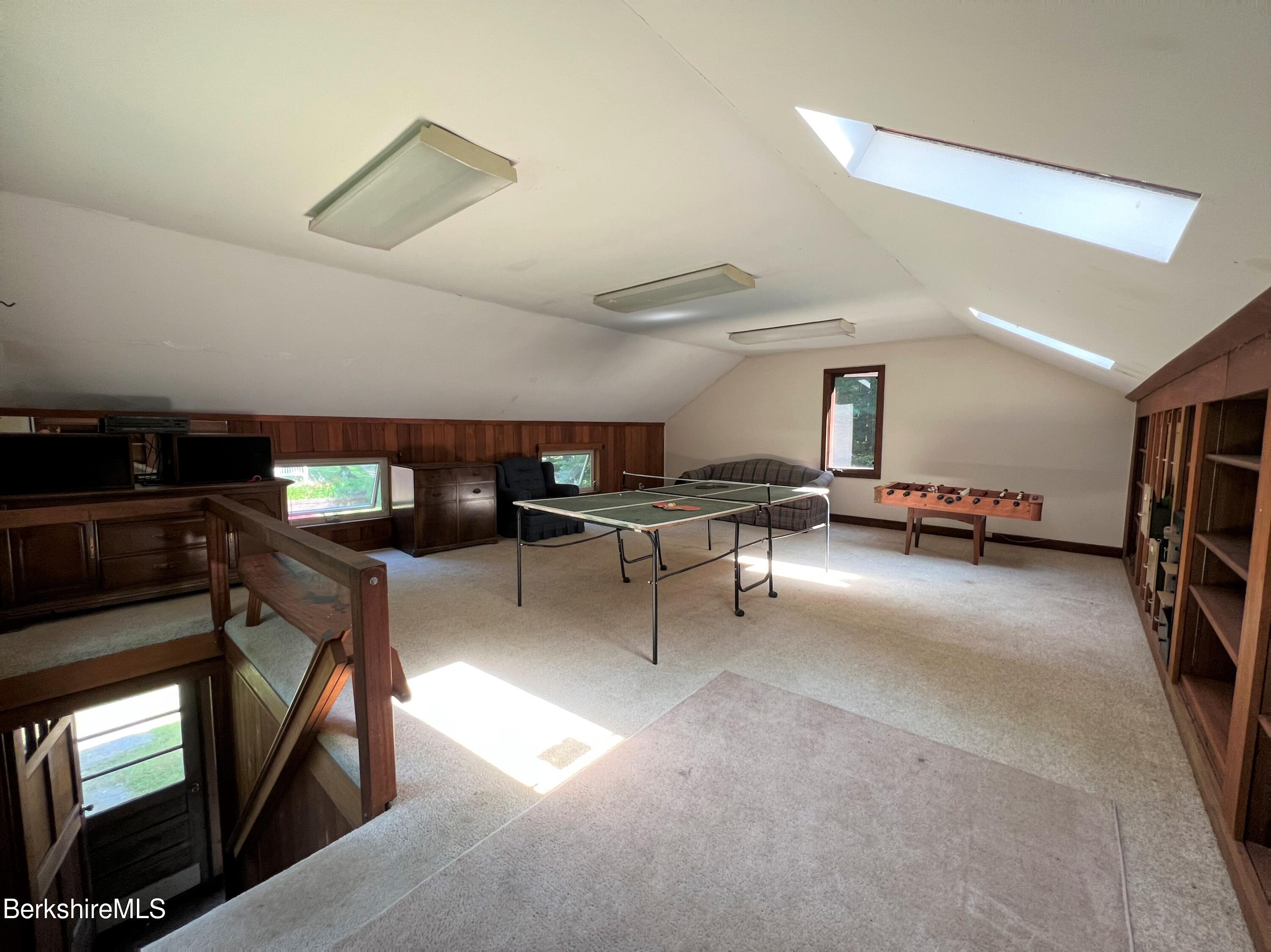 280 Middlefield Road Washington, MA 01223 - Photo 4 of 28 a living room with furniture gym equipment and a window