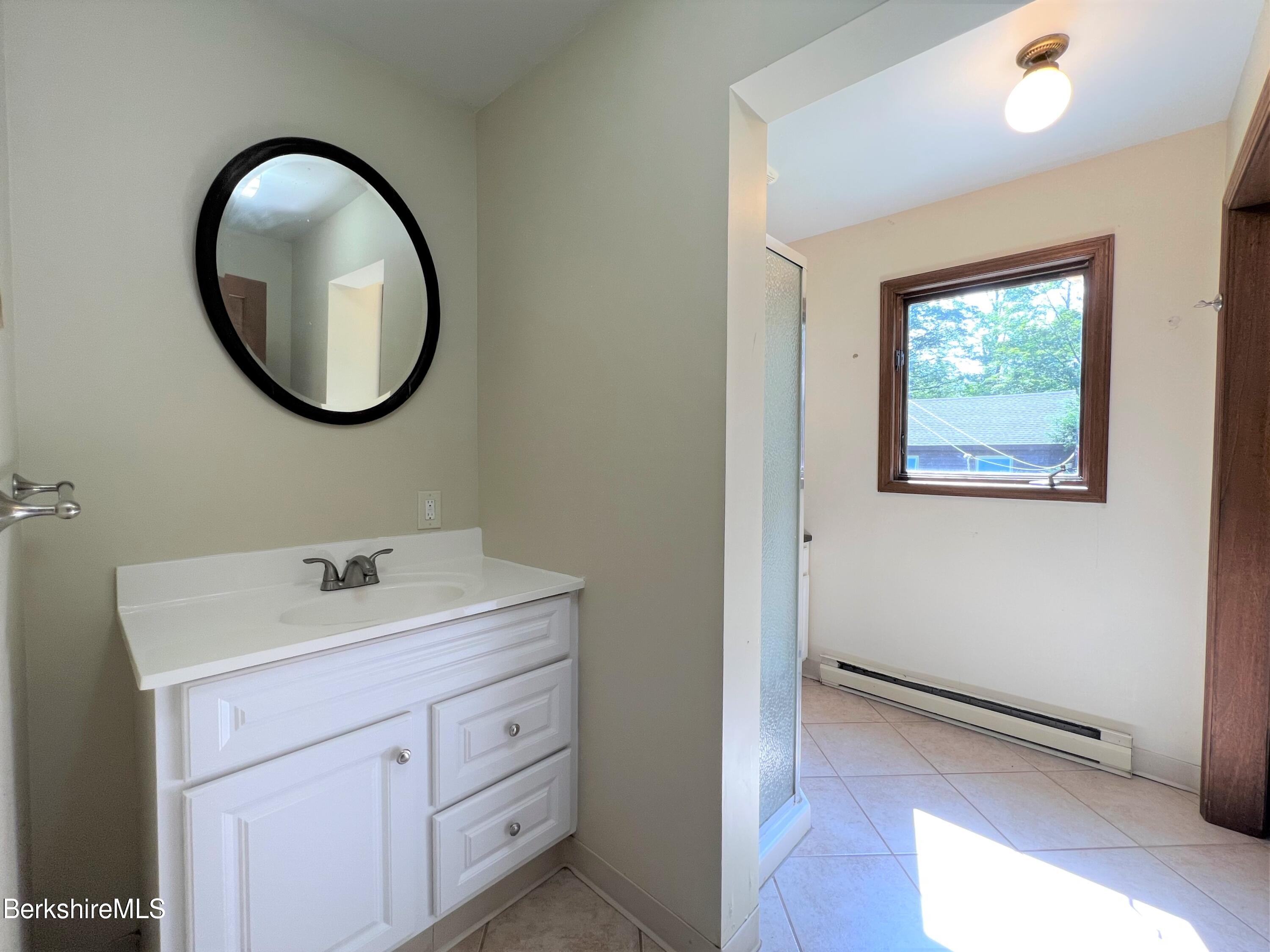 280 Middlefield Road Washington, MA 01223 - Photo 8 of 28 a bathroom with a toilet a sink and a mirror