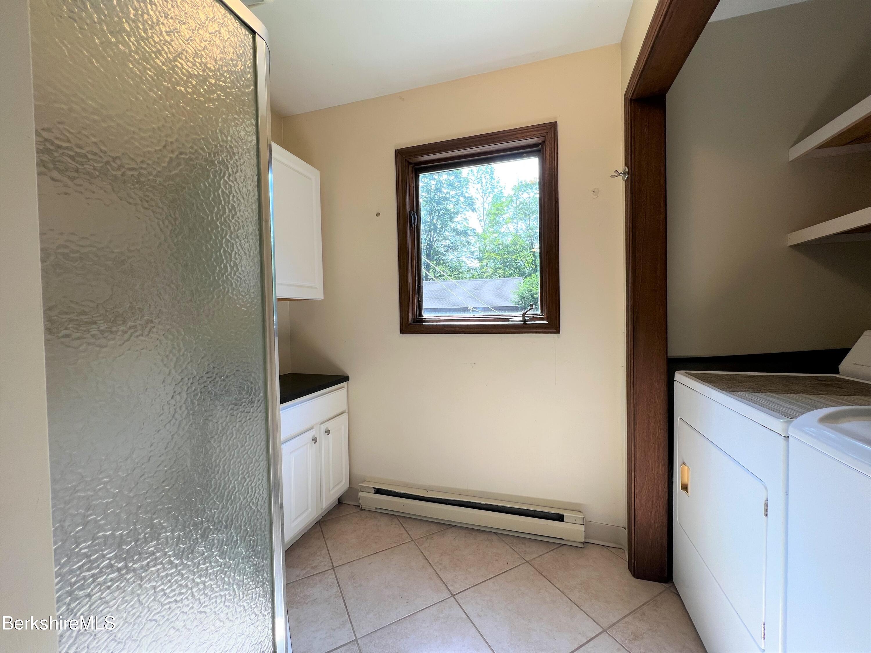 280 Middlefield Road Washington, MA 01223 - Photo 9 of 28 a view of a kitchen with white cabinets