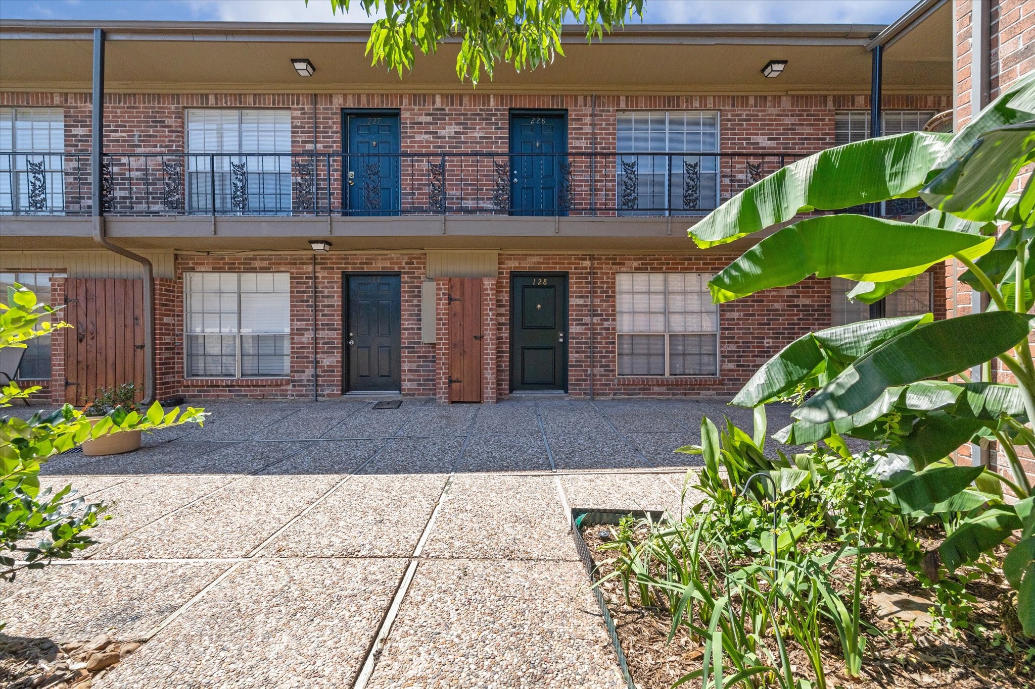 a view of a brick building with many windows