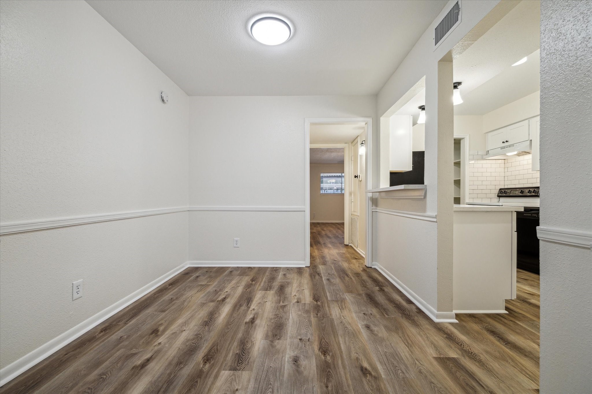 11540 Chimney Rock Road, Unit 128 Houston, TX 77035 - Photo 4 of 14 a view of a kitchen with wooden floor