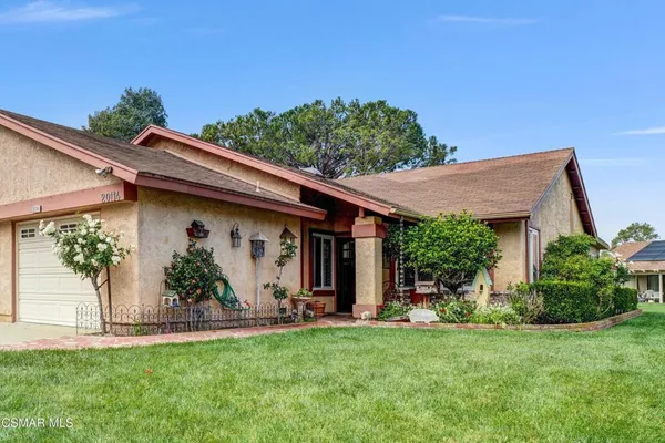 a view of a patio with table and chairs and potted plants