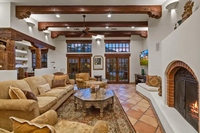 a view of a livingroom with furniture and staircase
