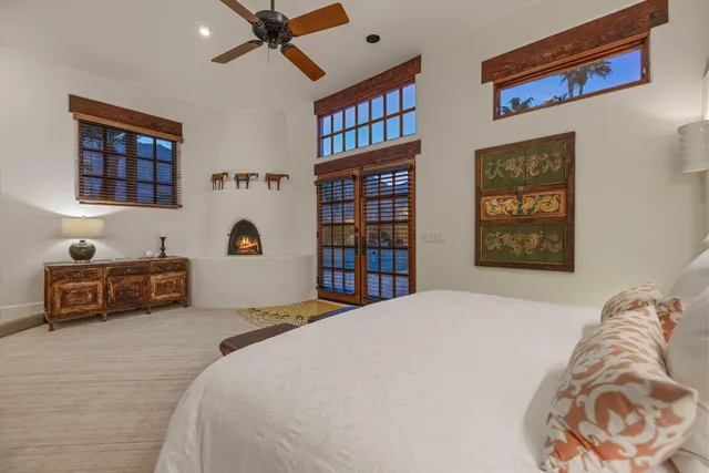 a bedroom with a bed and a mirror