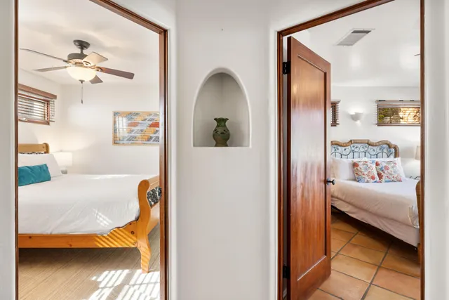 a view of a park with a bench and trees