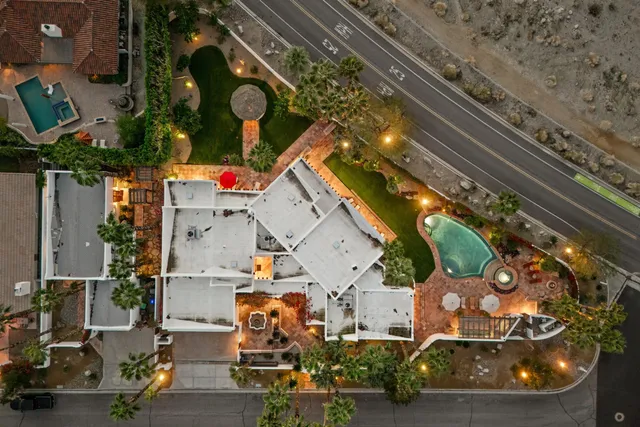 a spacious bedroom with two beds and a large window