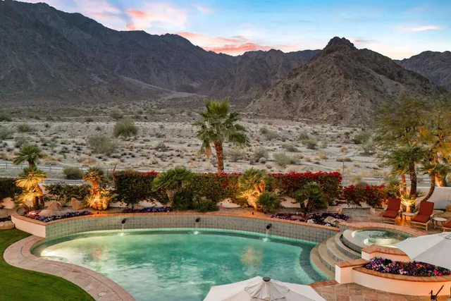 a bedroom with a large bed closet and window