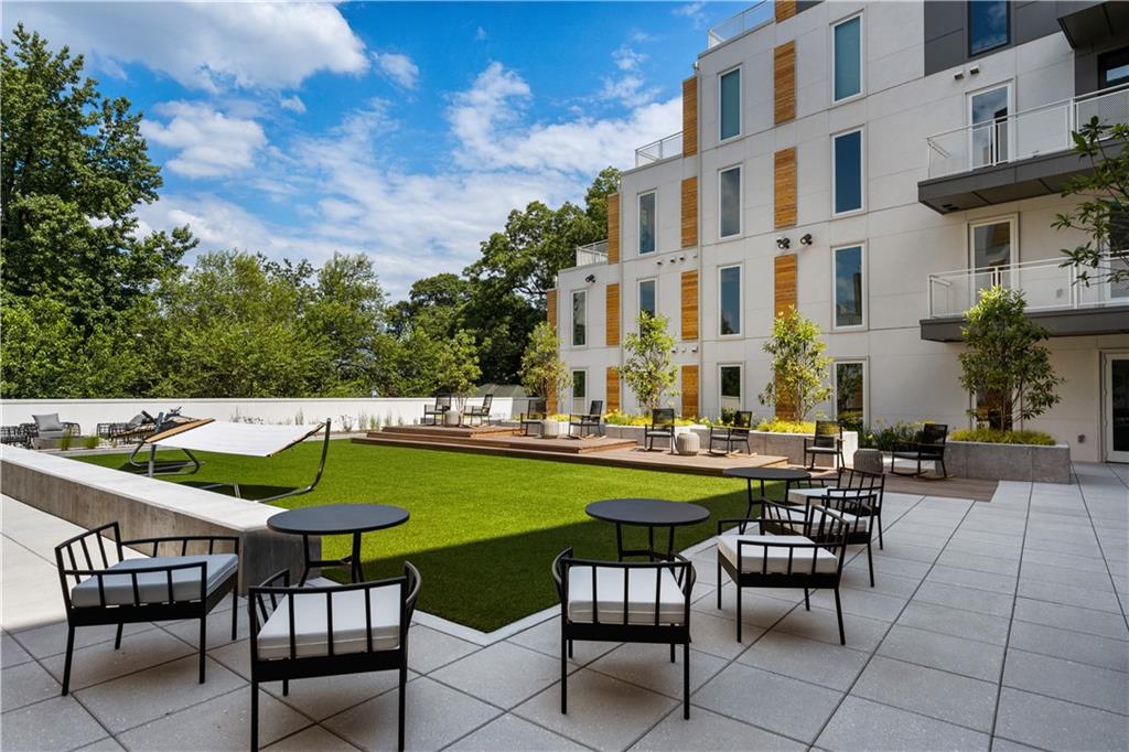 775 Juniper Street Northeast, Unit 309 Atlanta, GA 30308 - Photo 15 of 49 a view of a swimming pool with chairs