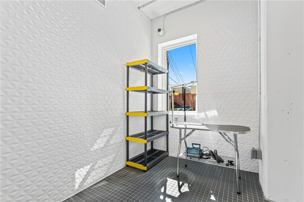 775 Juniper Street Northeast, Unit 309 Atlanta, GA 30308 - Photo 40 of 49 a view of storage and utility room with wooden floor