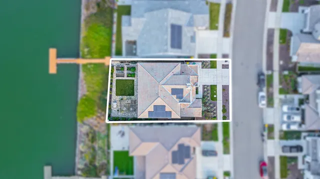 an aerial view of a house with swimming pool