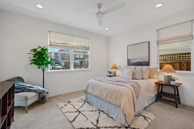 a bedroom with a bed and a couch