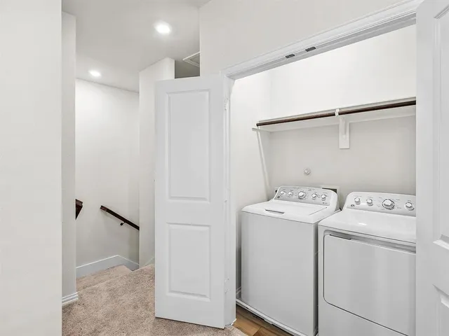 a view of storage and utility room with washer and dryer