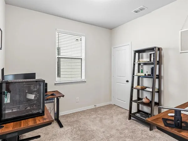 a view of room with workspace and window
