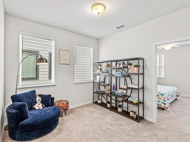 a bedroom with furniture and a window