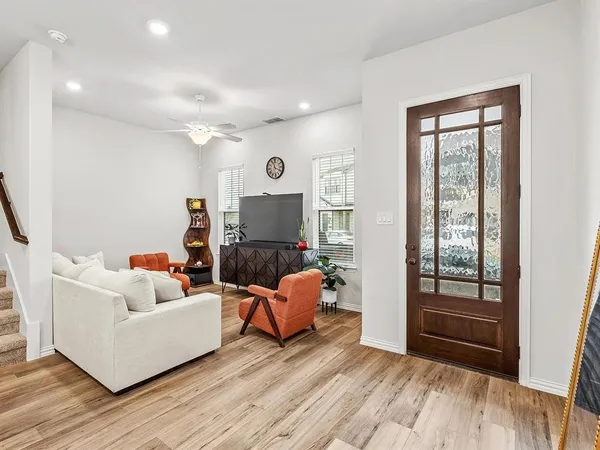 a living room with furniture and a window