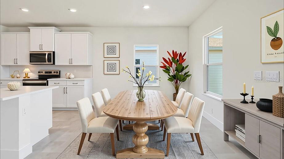 4256 Southwest 52nd Lane Road Ocala, FL 34474 - Photo 4 of 24 a dining room with furniture and wooden floor