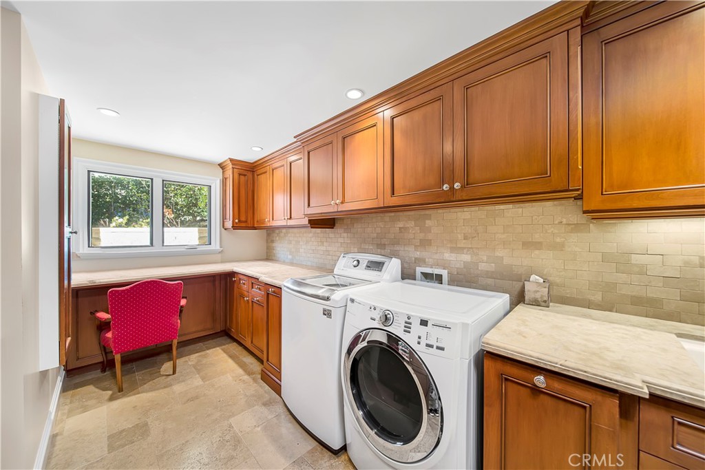 822 Emerald Bay Laguna Beach, CA 92651 - Photo 23 of 26 a utility room with sink dryer and washer