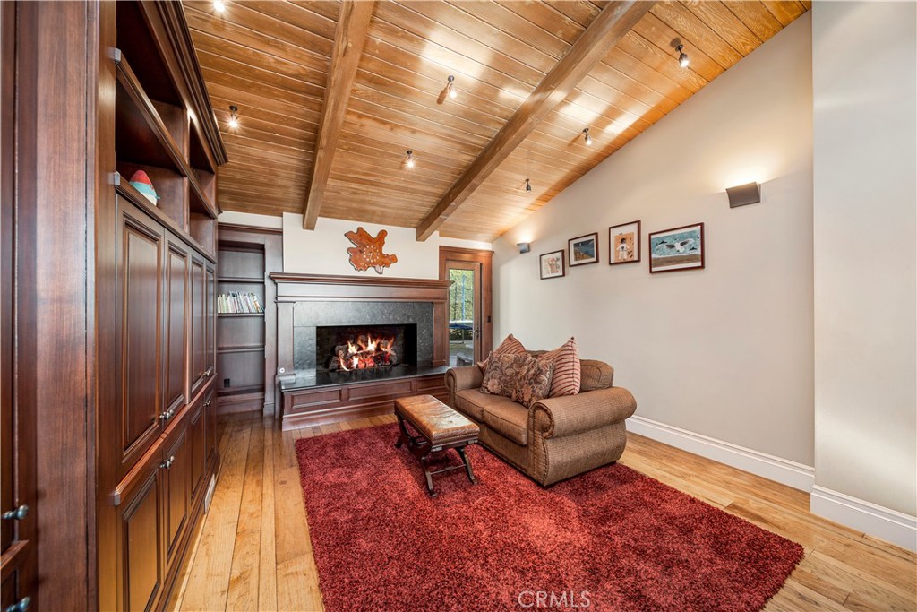 822 Emerald Bay Laguna Beach, CA 92651 - Photo 10 of 26 a living room with furniture and a fireplace