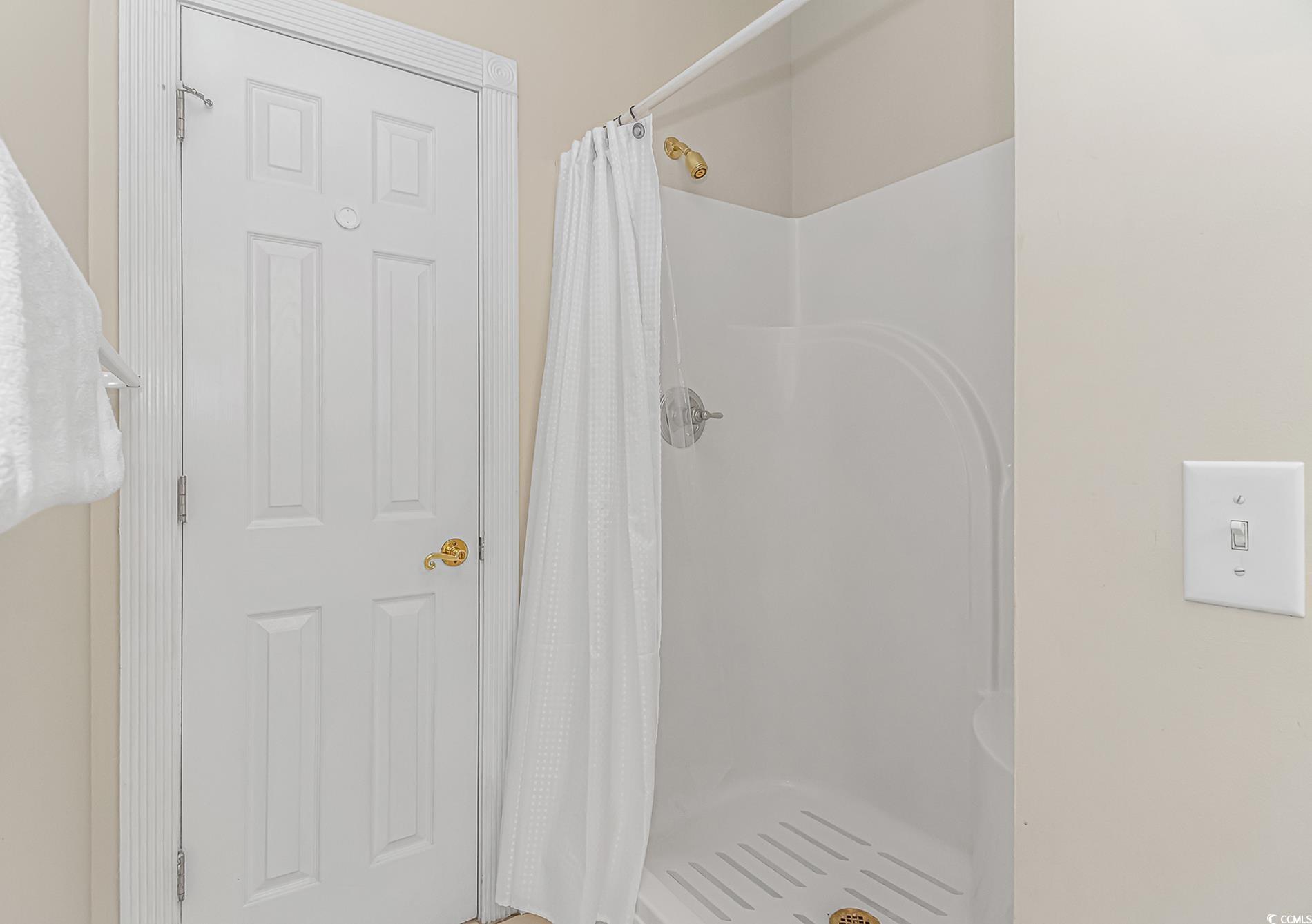4647 Wild Iris Drive, Unit 303 Myrtle Beach, SC 29577 - Photo 20 of 29 Bathroom featuring a stall shower