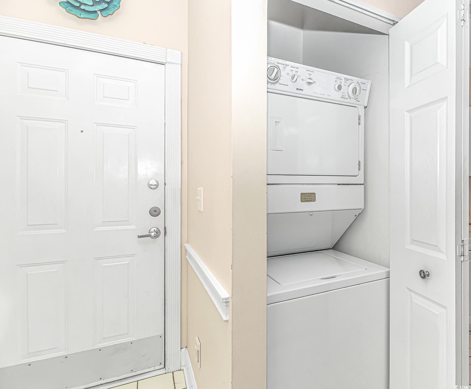 4647 Wild Iris Drive, Unit 303 Myrtle Beach, SC 29577 - Photo 8 of 29 Laundry area with stacked washing machine and dryer