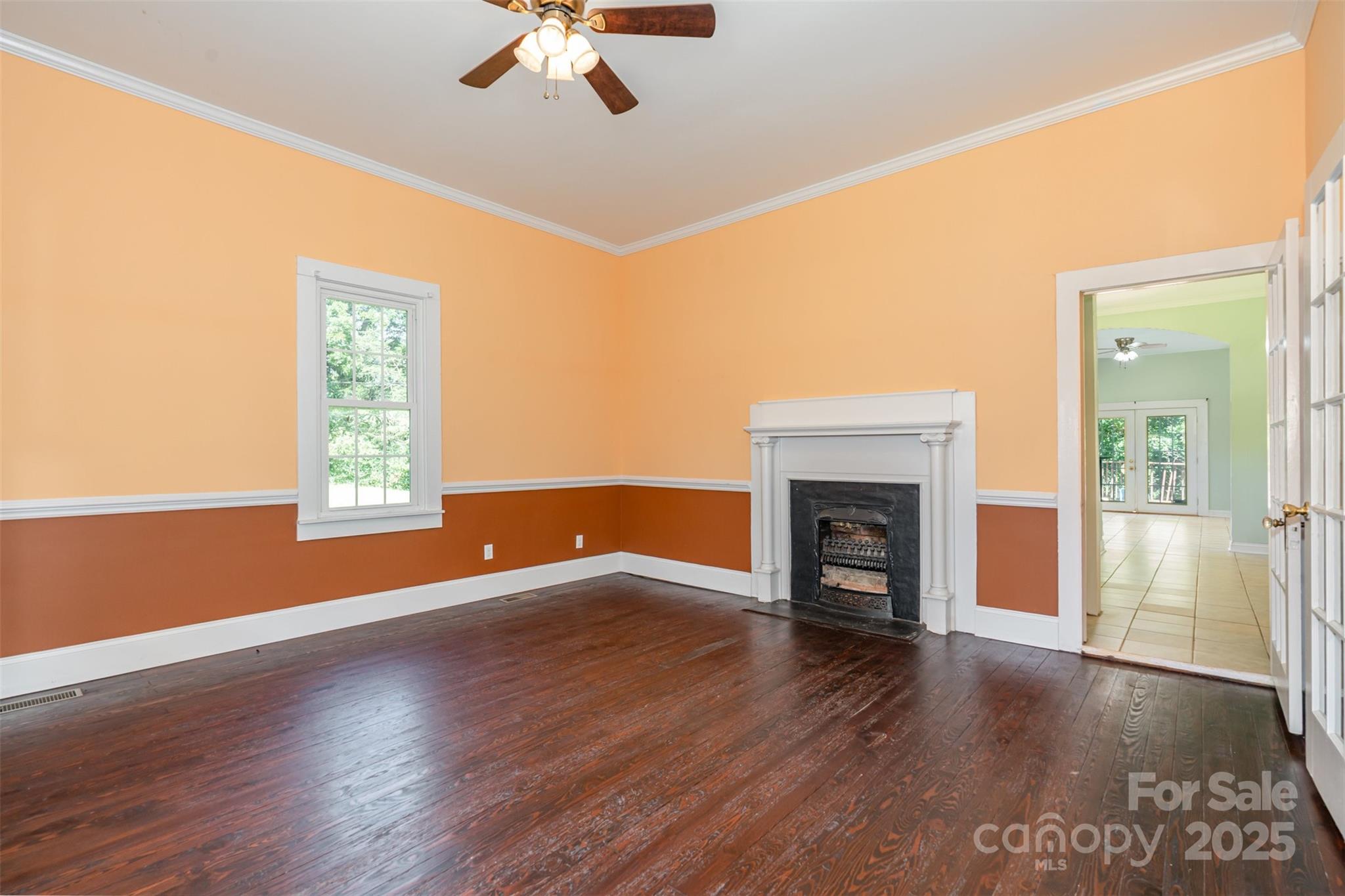 4030 Peachtree Street Hickory Grove, SC 29717 - Photo 12 of 21 an empty room with windows fireplace and wooden floor