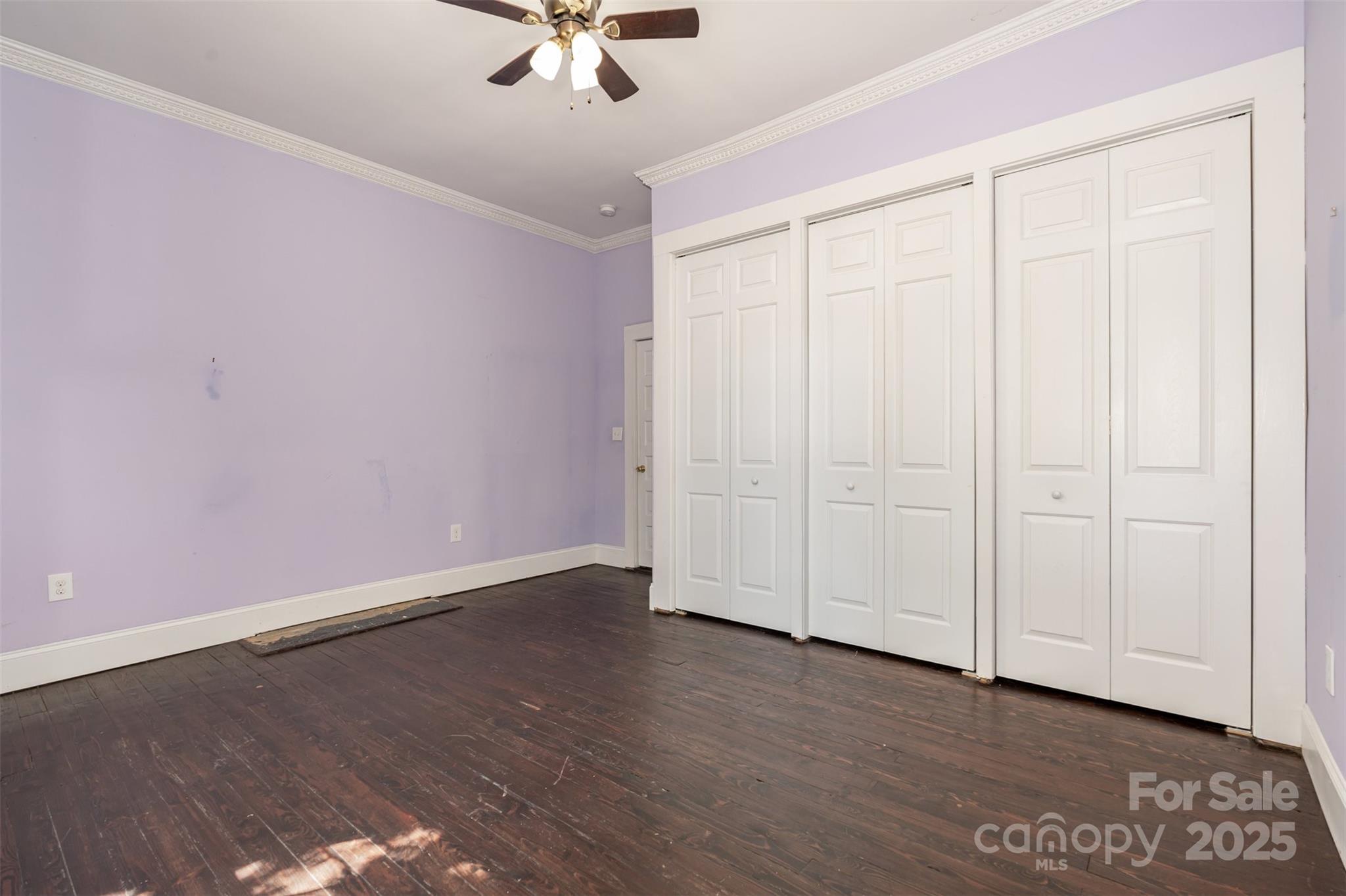 4030 Peachtree Street Hickory Grove, SC 29717 - Photo 16 of 21 an empty room with wooden floor closet and windows