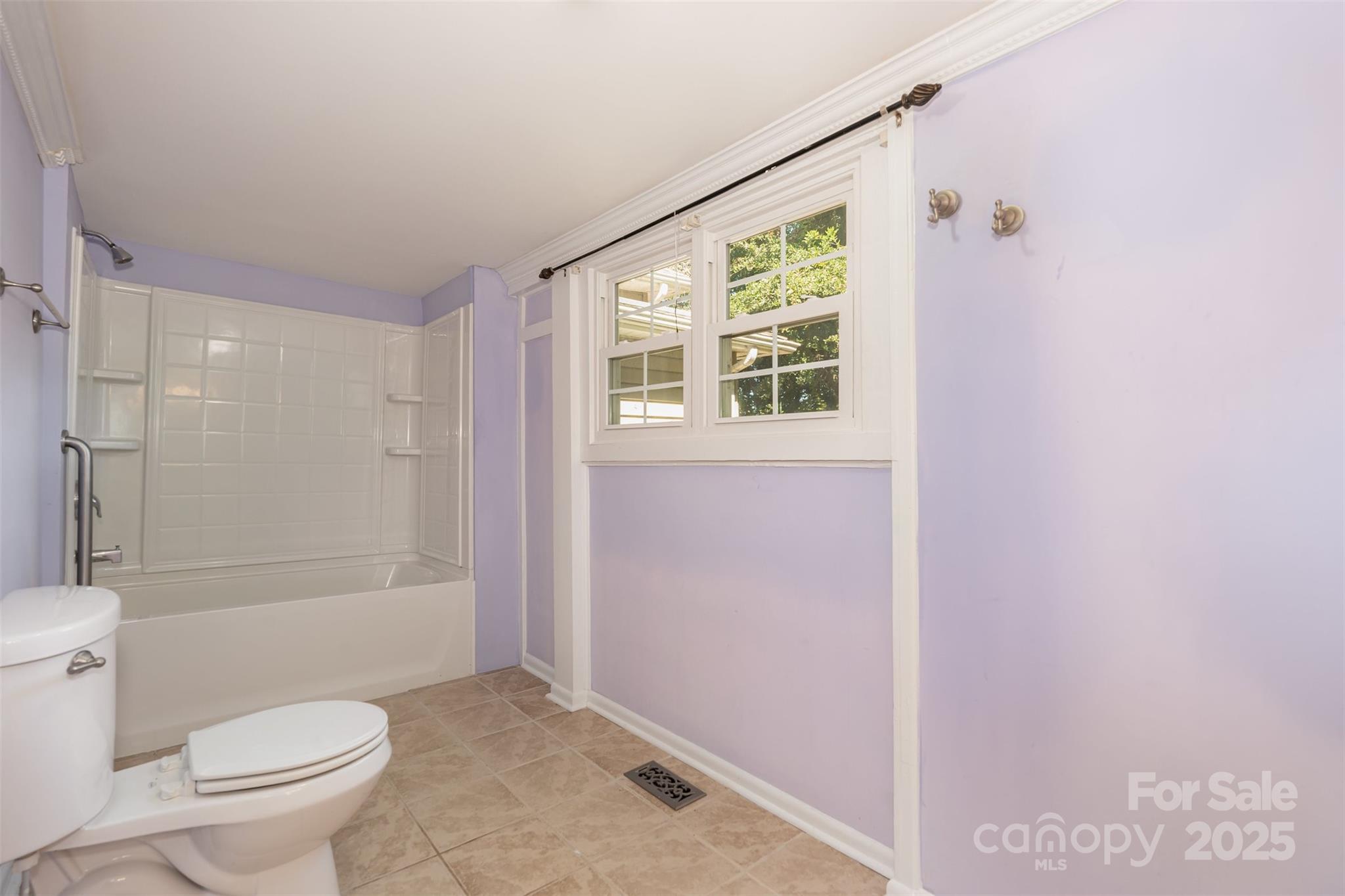 4030 Peachtree Street Hickory Grove, SC 29717 - Photo 17 of 21 a bathroom with a granite countertop sink a toilet and shower