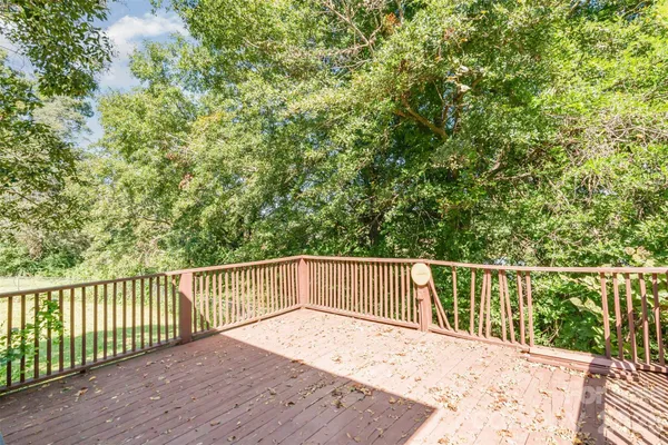 a house view with swimming pool in front of the house