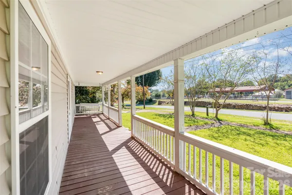 a view of balcony with wooden floor